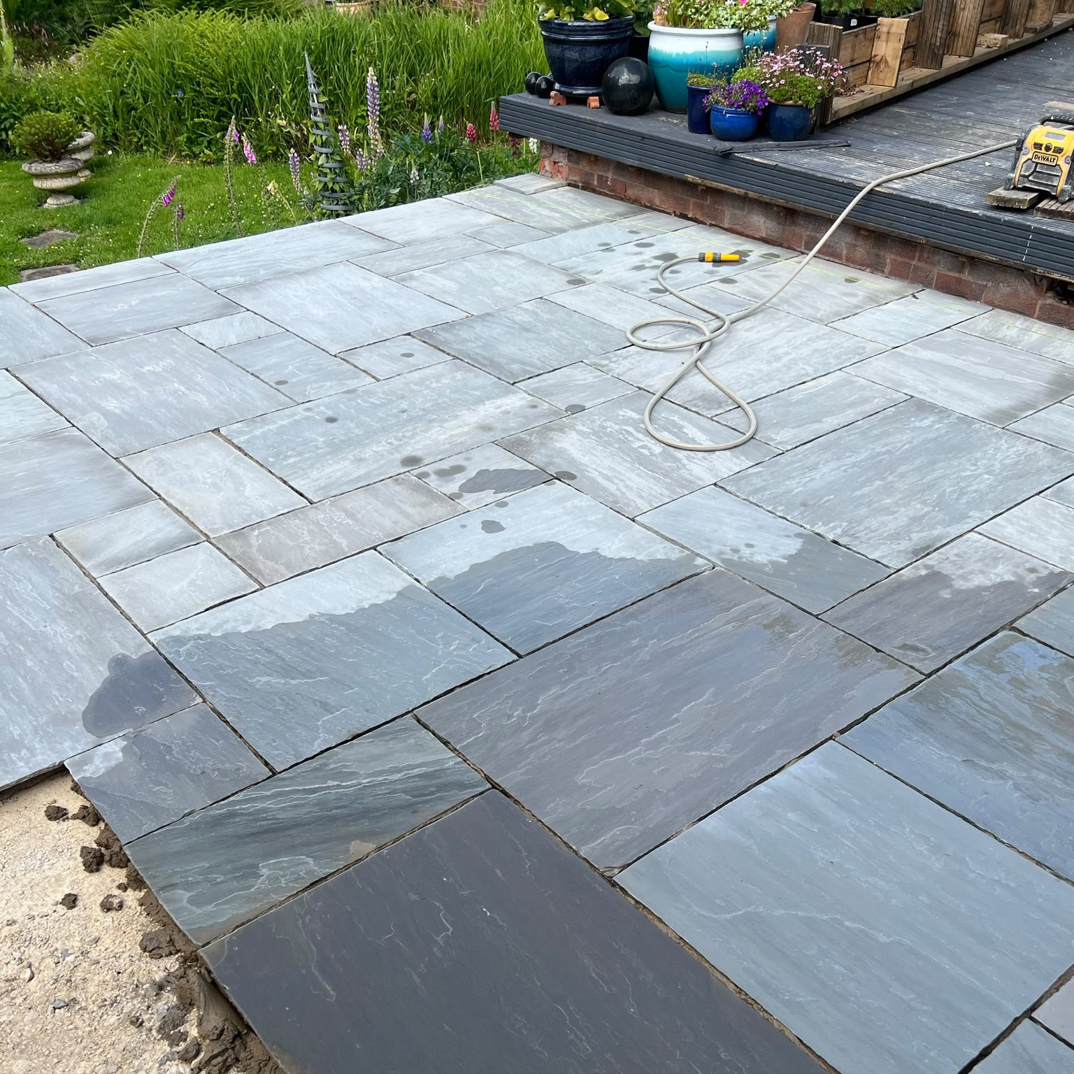 Finished patio and landscaping work with clean paving lines